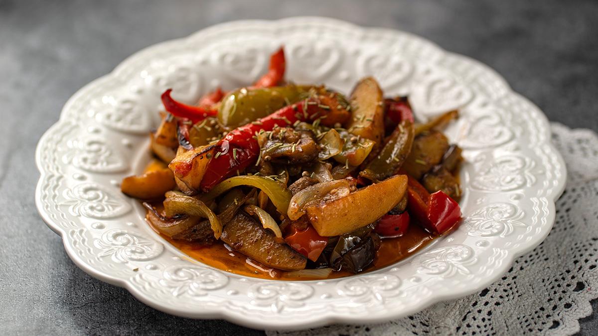 vegetable stew   ciambotta in a ceramic white plate on the backg