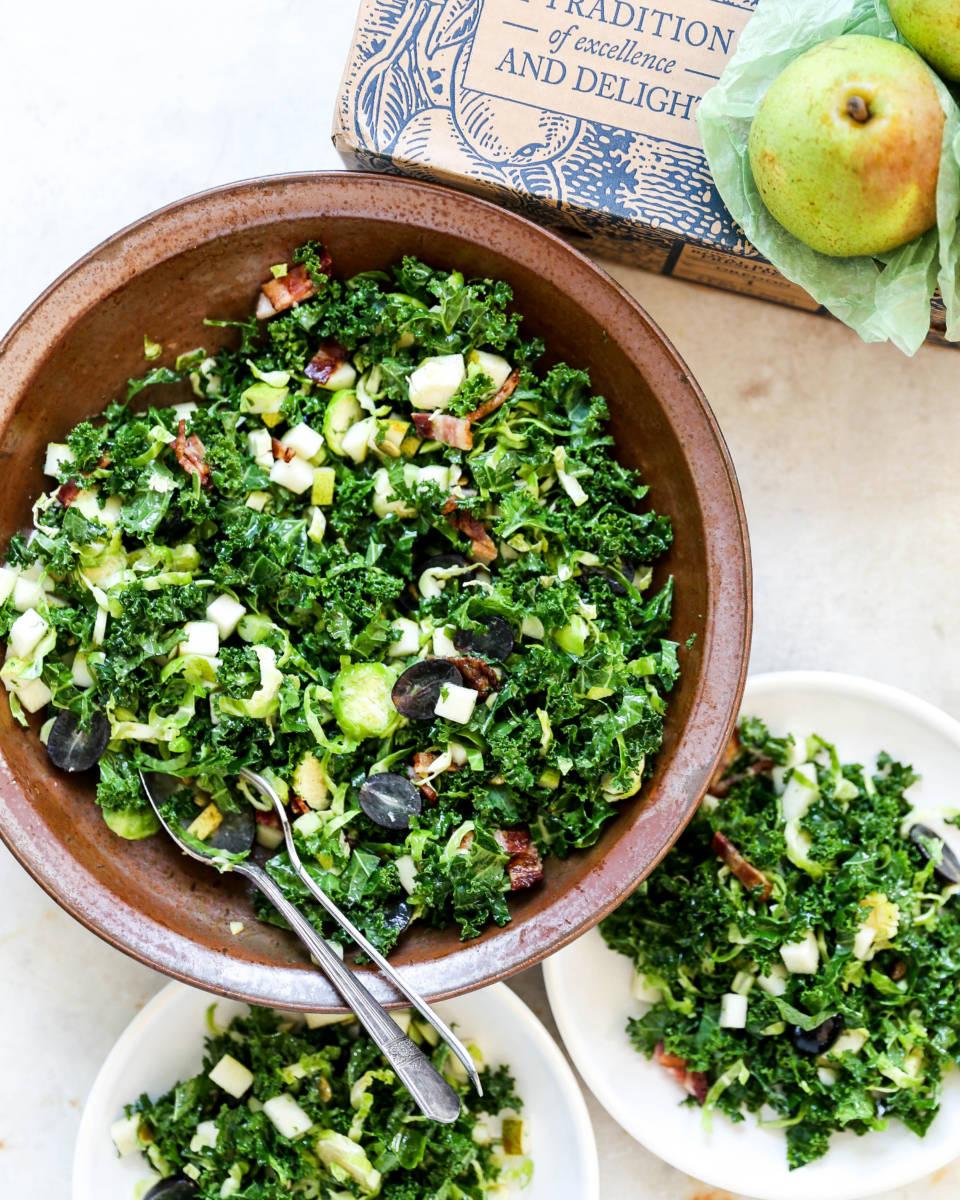 Shredded Kale and Brussels Sprouts Salad with Pears, Grapes, and Bacon