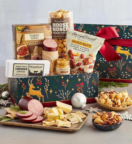 Gifts under $ with a box full of savory snacks like cheese, meat and crackers.