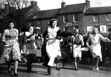 Bucket list. A photo of the Olney pancake race in , women race while holding pancakes in skillets.