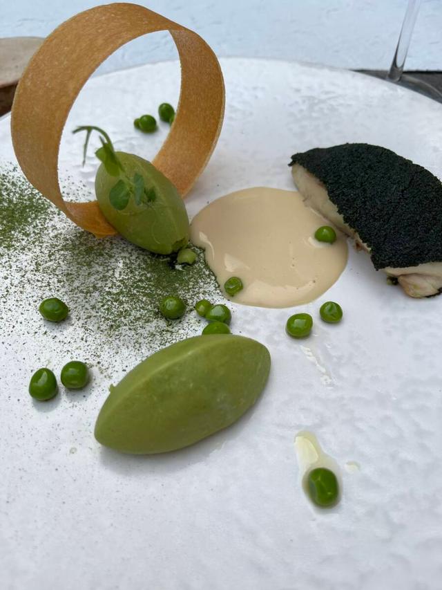 Plated like a piece of art, the seasonal dishes at Envol might include spirulina coated seabass with fresh pea purée.