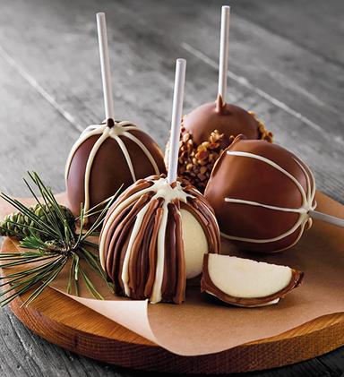 Types of apples covered in caramel and chocolate.