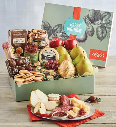 th birthday ideas with a box of fruit, chocolate, cheese, and other snacks.