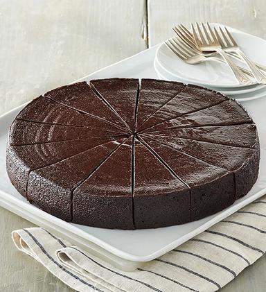 Flourless chocolate cake on a plate.