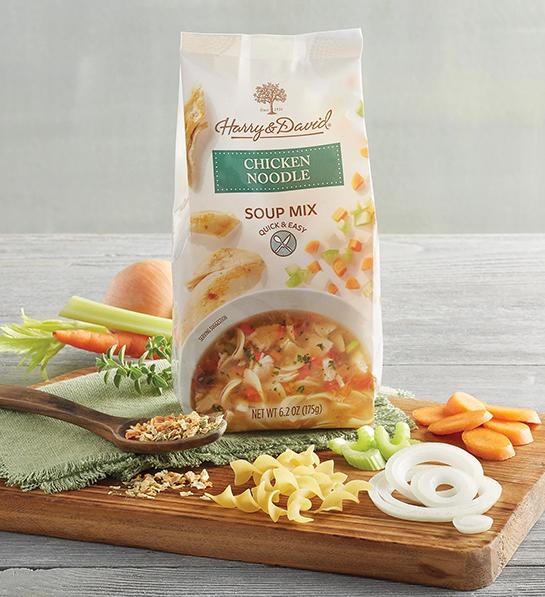 Feel better gifts with a packaged soup mix surrounded by fresh ingredients.