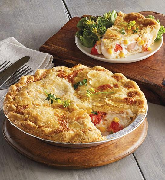 Feel better gifts with a lobster pot pie on a wooden table.