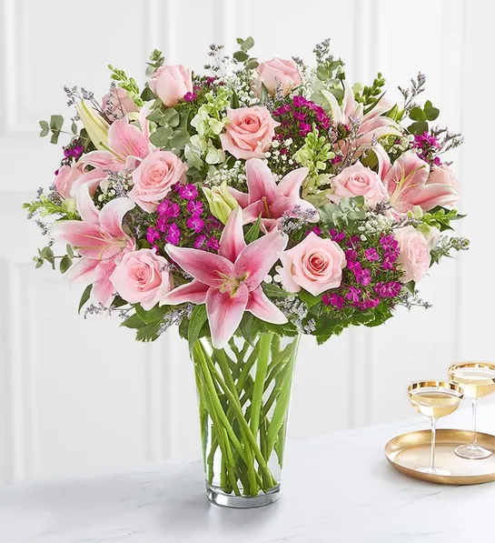 Last minute gift ideas for mom with a bouquet of purple and pink flowers in a glass vase