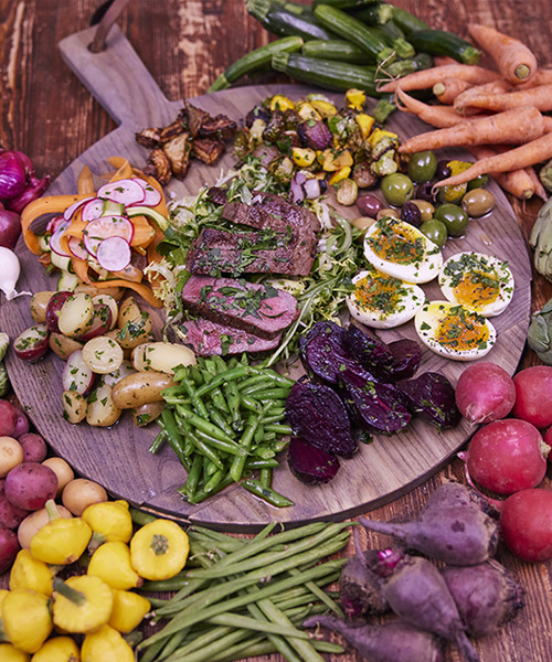 Bourbon peppercorn Marinated Steak Salad with Soft boiled Egg and Crispy Artichokes