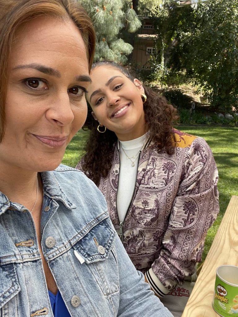 Antonia Lofaso and daughter sitting at a picnic table.