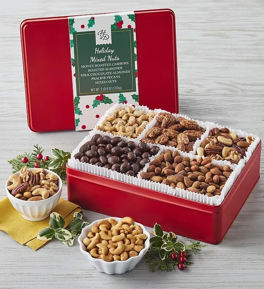 Christmas gift ideas for him with a tin of multiples kinds of nuts decorated for Christmas