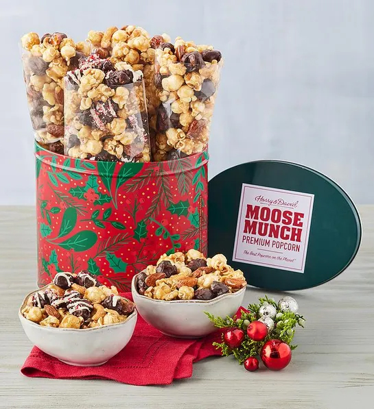 Gifts under  with a Christmas decorated tin full of Moose Munch popcorn