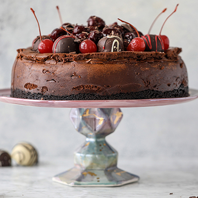 Chocolate truffle cherry cheesecake on a platter