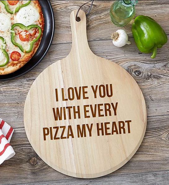 A photo of relationship length with a personalized pizza board