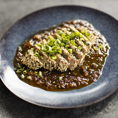 Plate with sliced tuna steak with sauce for Fathers Day recipes