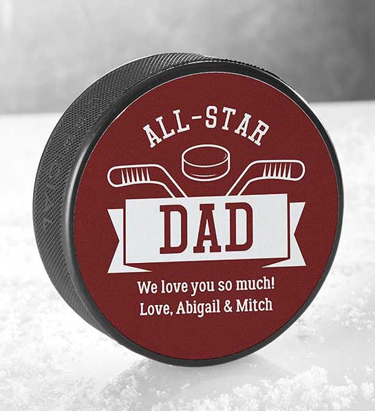 A photo of fathers day gift guide with a personalized hockey puck