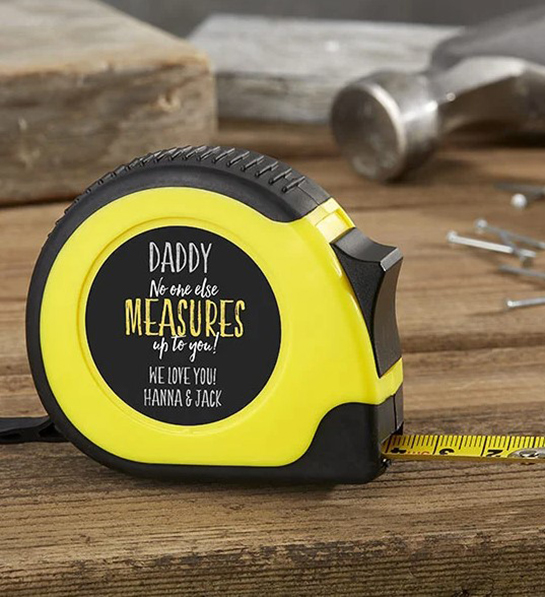 A photo of fathers day gift guide with a customized tape measure