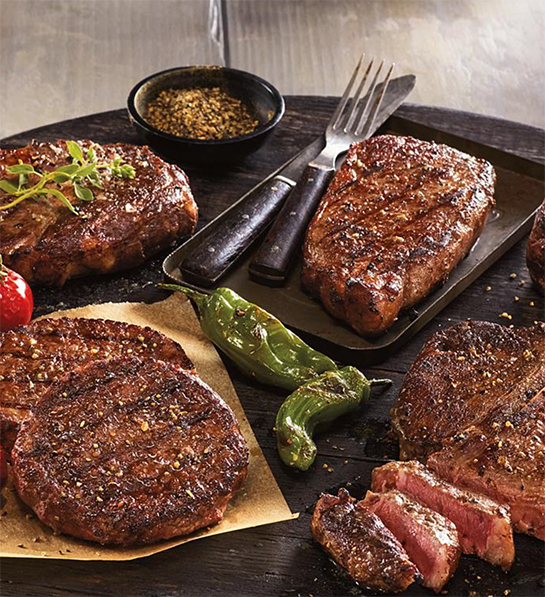 Photo of grilling gifts with a platter of several different cuts of grilled meat