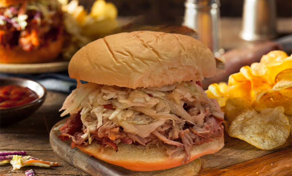 Wines for tailgating with a pulled pork sandwich