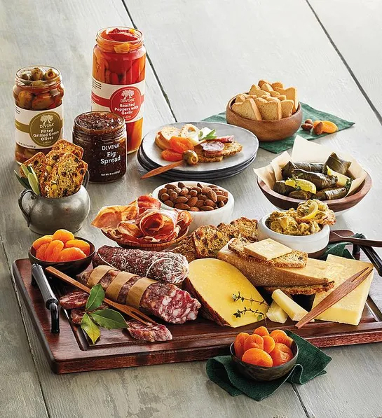 Gifting matrix with a group with a collection of meats cheeses and other finger foods