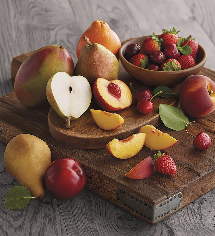 Gifting matrix with a collection of fresh fruit on a wooden board