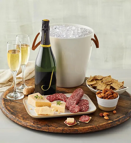 Gifting matrix with a bucket of ice next to a bottle of sparkling wine with two glasses