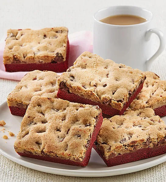 History of red velvet cake with a plate of red velvet brookies next to a cup of tea