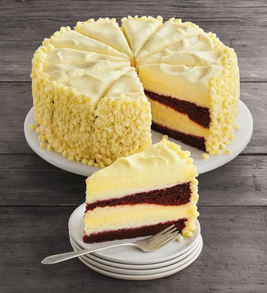 History of red velvet cake with a red velvet cheesecake on a platter