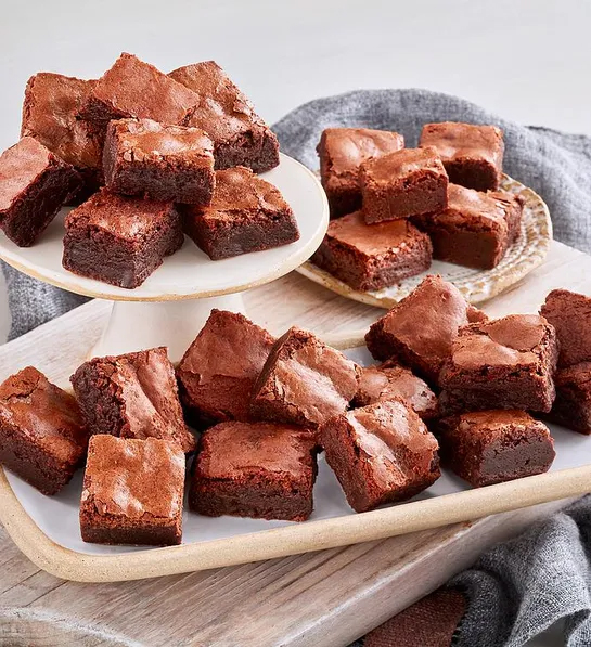 Gluten free cakes with a plate of chocolate brownies