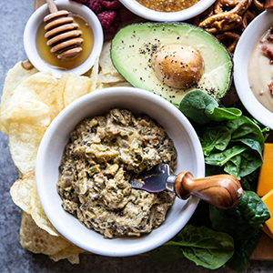 Spinach dip on a snack board