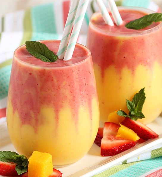 Mango strawberry smoothie in two glasses