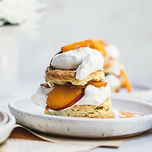 Peaches and cream shortcake on a plate