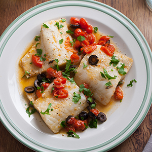 Fish fillet with cherry tomatoes and olives