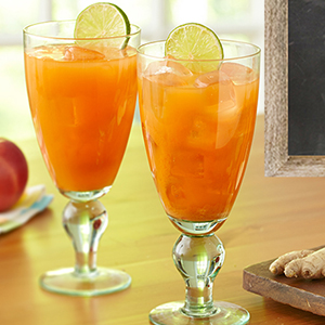 Two carrot juice cocktails on a table