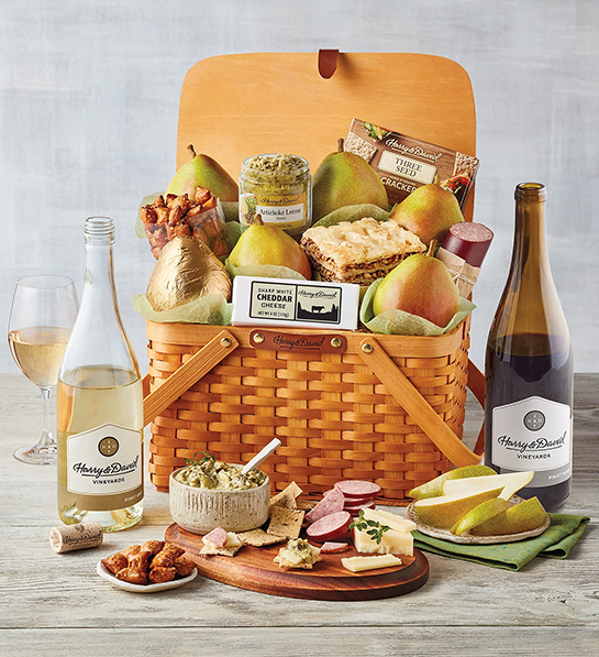 Pinot Gris with a picnic basket full of pears snacks and other snacks