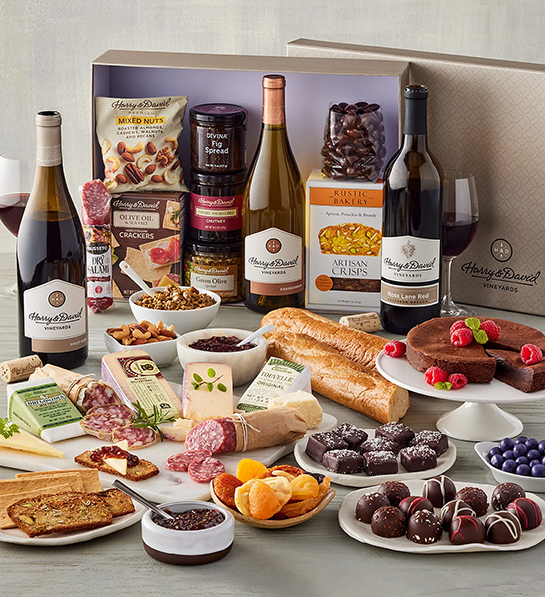 Ultimate wine pairing cheese gift with bottles of wine types of cheese sweet and savory snacks