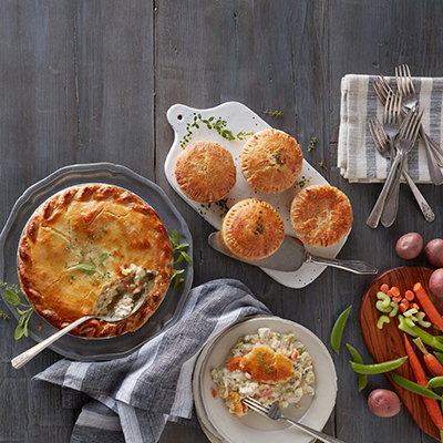 Winter wine pairings with multiple pot pies on a counter