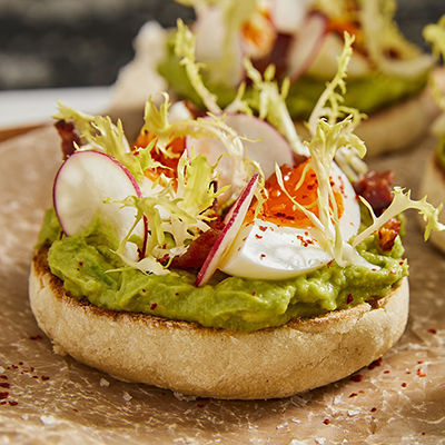 Breakfast for dinner with avocado toast on a plate