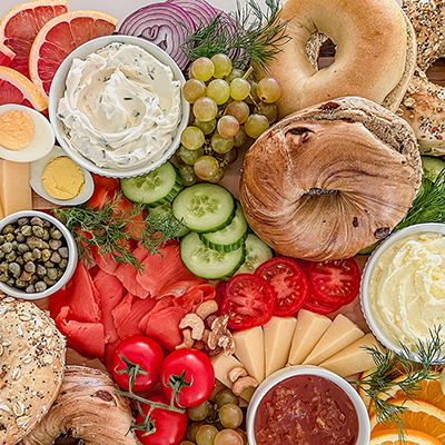 Spread of bagels cream cheese and other toppings