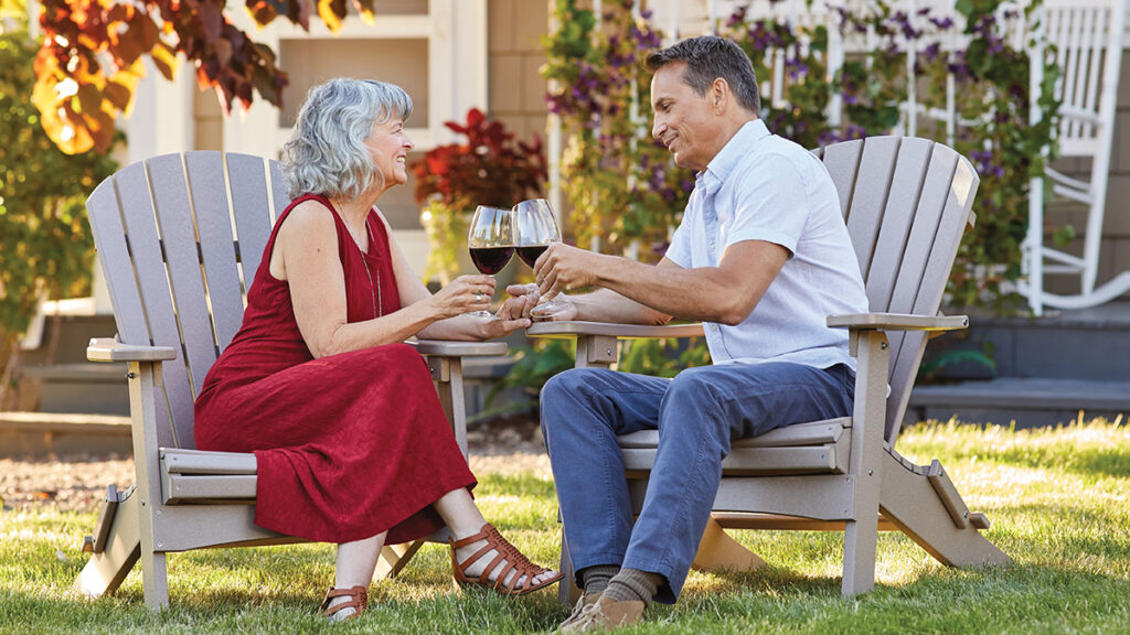 Couple drinking wine outside.