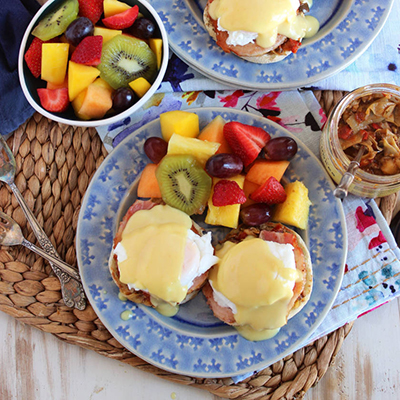 Eggs Benedict with artichokes and fruit