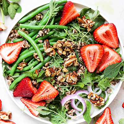 Strawberry recipes with a salad full of strawberries and nut clusters