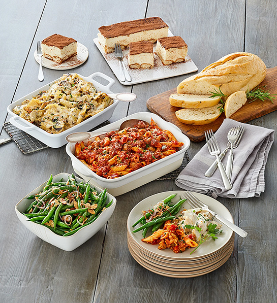 Gifts for the home cook with a table carrying multiple Italian dishes