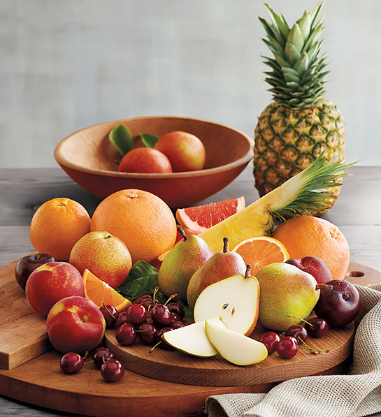 Thoughtful food gifts with a display of different types of fruit on a platter