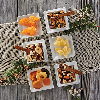 Ways to use dried fruit with several containers of dried fruit and nuts