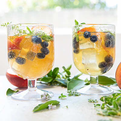 Ways to use fruit with two glasses of peach sangria